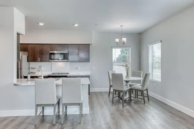 Kitchen with stainless appliances and a breakfast bar