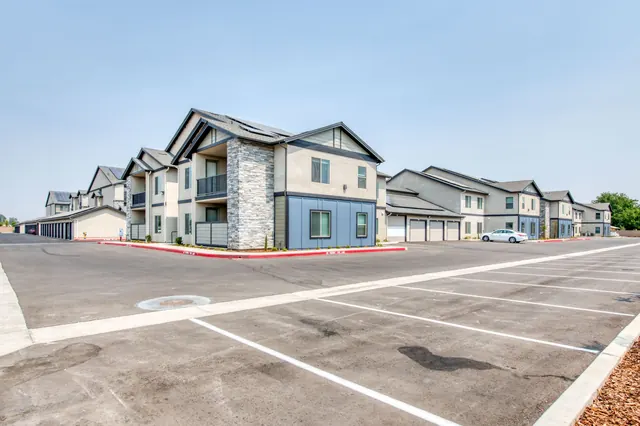 Resident parking with buildings beyond