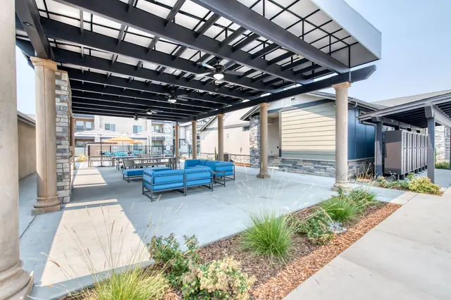 Covered outdoor lounge with blue seating