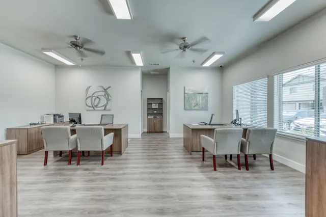 Clubhouse work area with desks and chairs