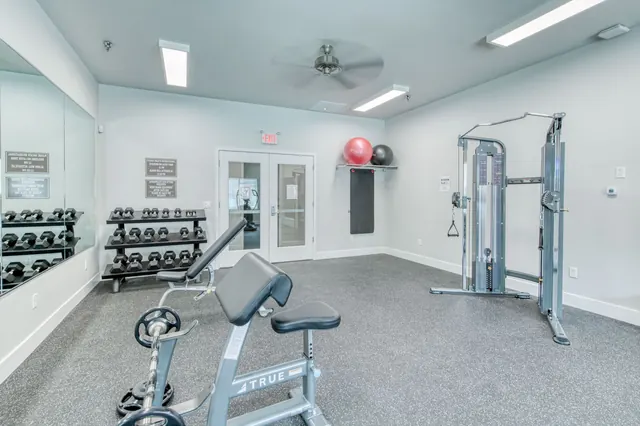 Fitness center free weights and cable trainer