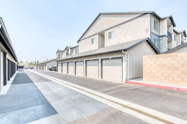 Row of private garages along a drive